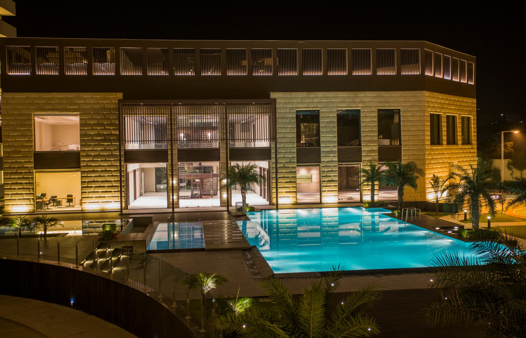 Salcon Verandas clubhouse and pool at night